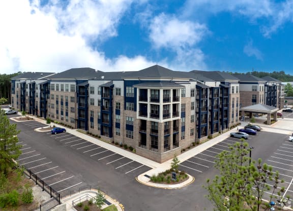 an aerial view of an apartment building in a parking lot at Preston Ridge, Cary, 27513